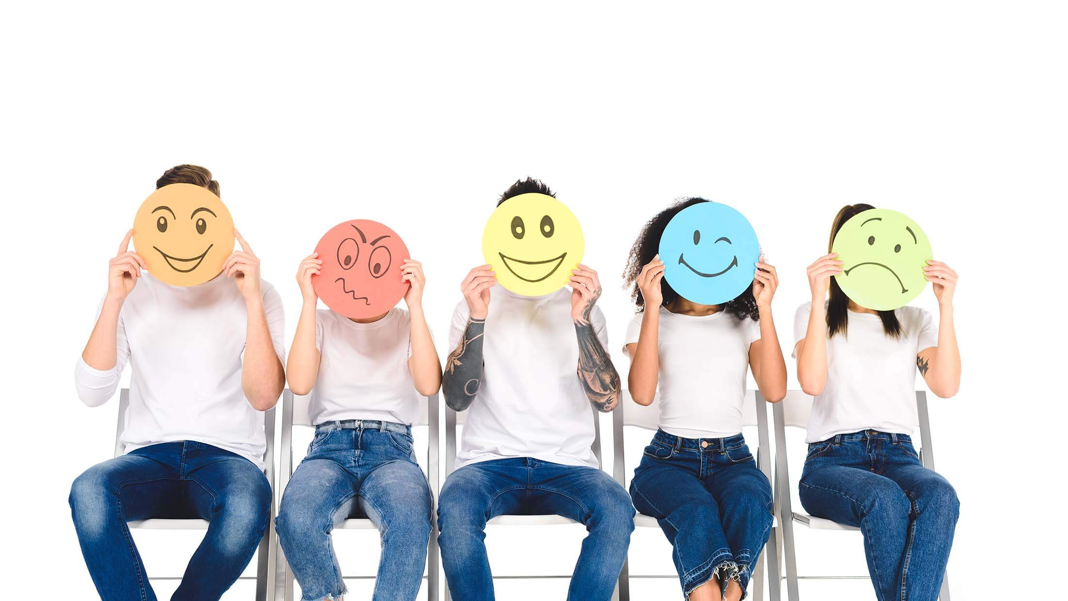 multicultural-friends-in-blue-jeans-sitting