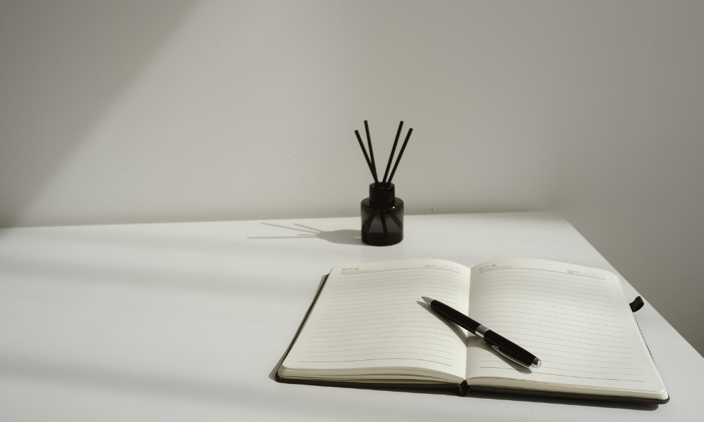 notebook with pen on a table