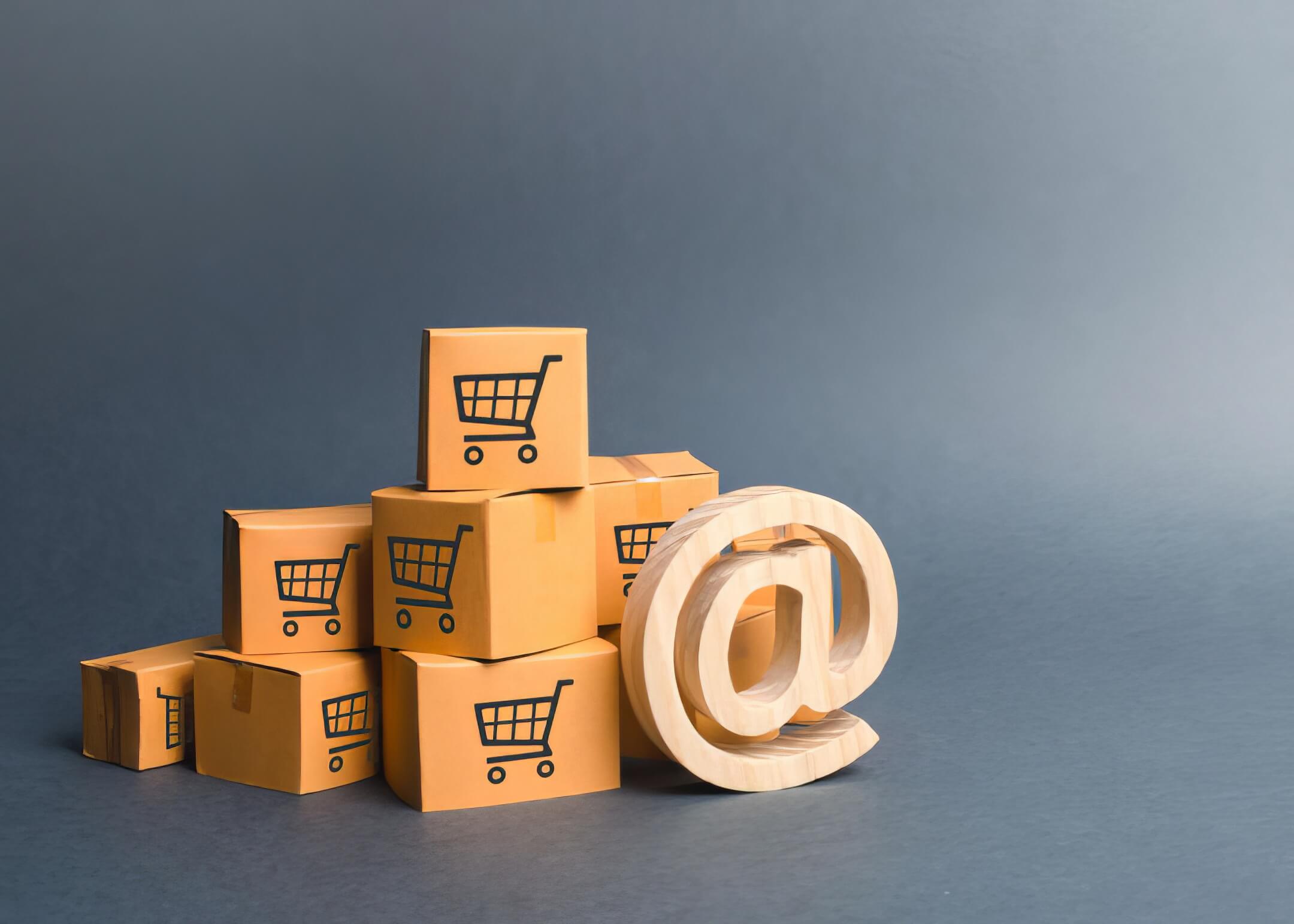 pile of cardboard boxes and email symbol