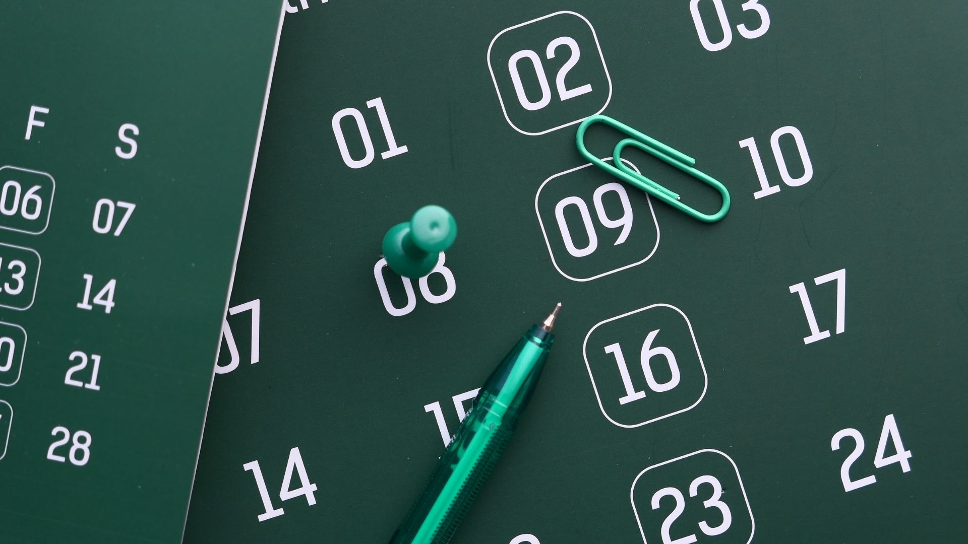 pin in a green calendar