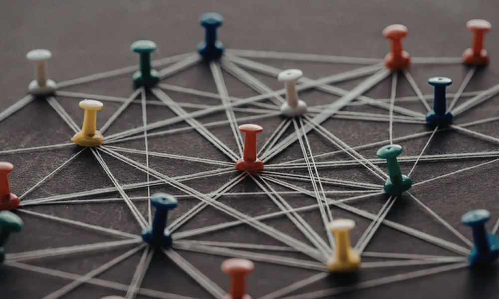 push pins connected by thread depicting local seo