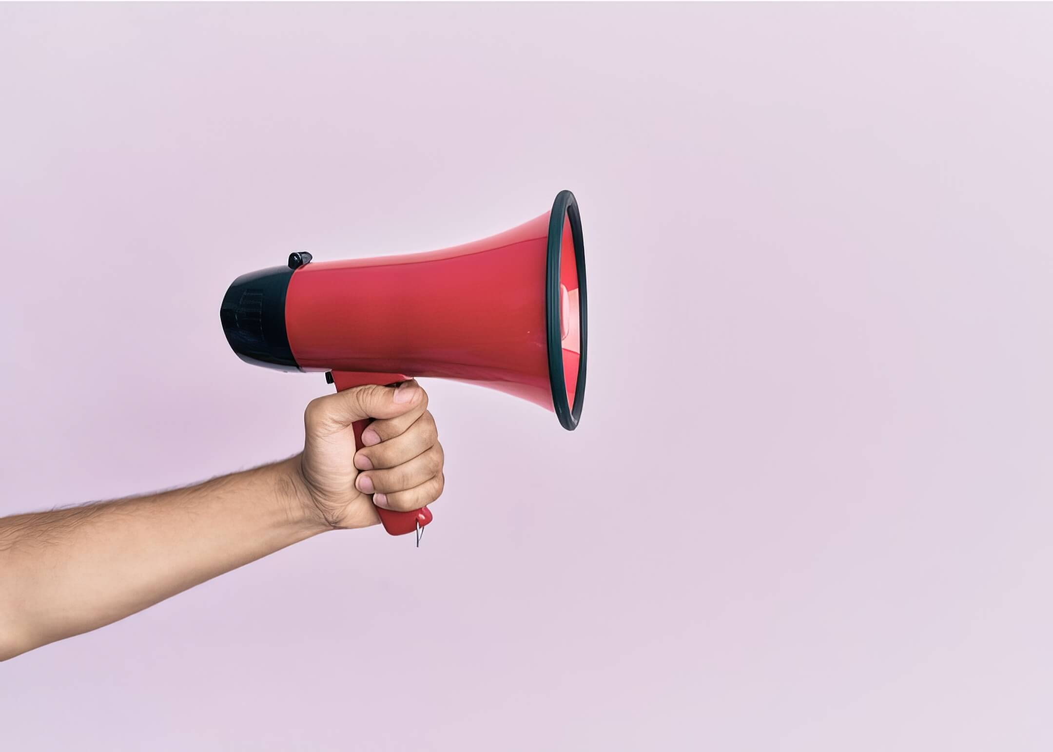 red megaphone in a violet background