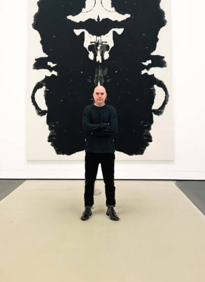 rodney in front a painting