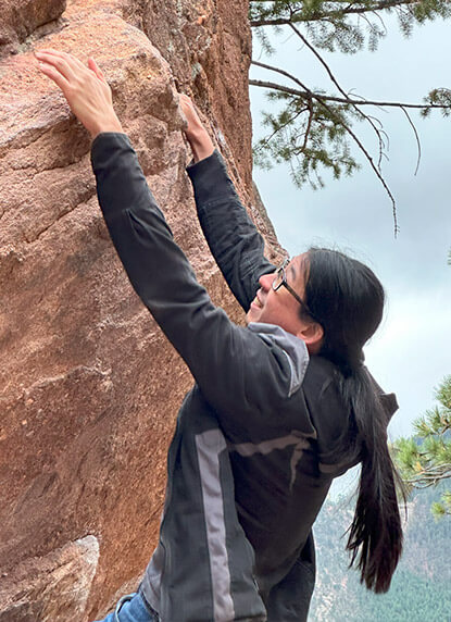 Ryan hanging on a big rock