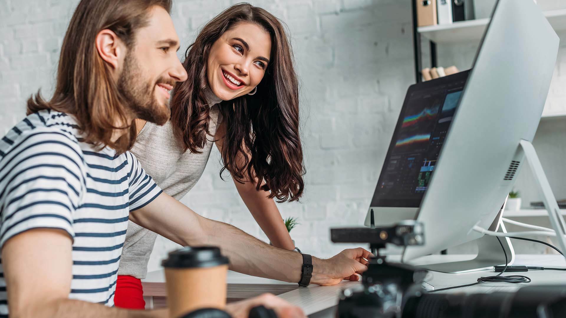 selective-focus-of-happy-art-editor-looking-at-computer