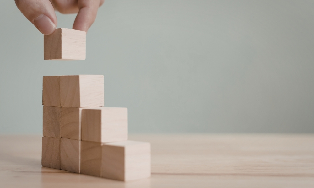 stacking wooden blocks one by one