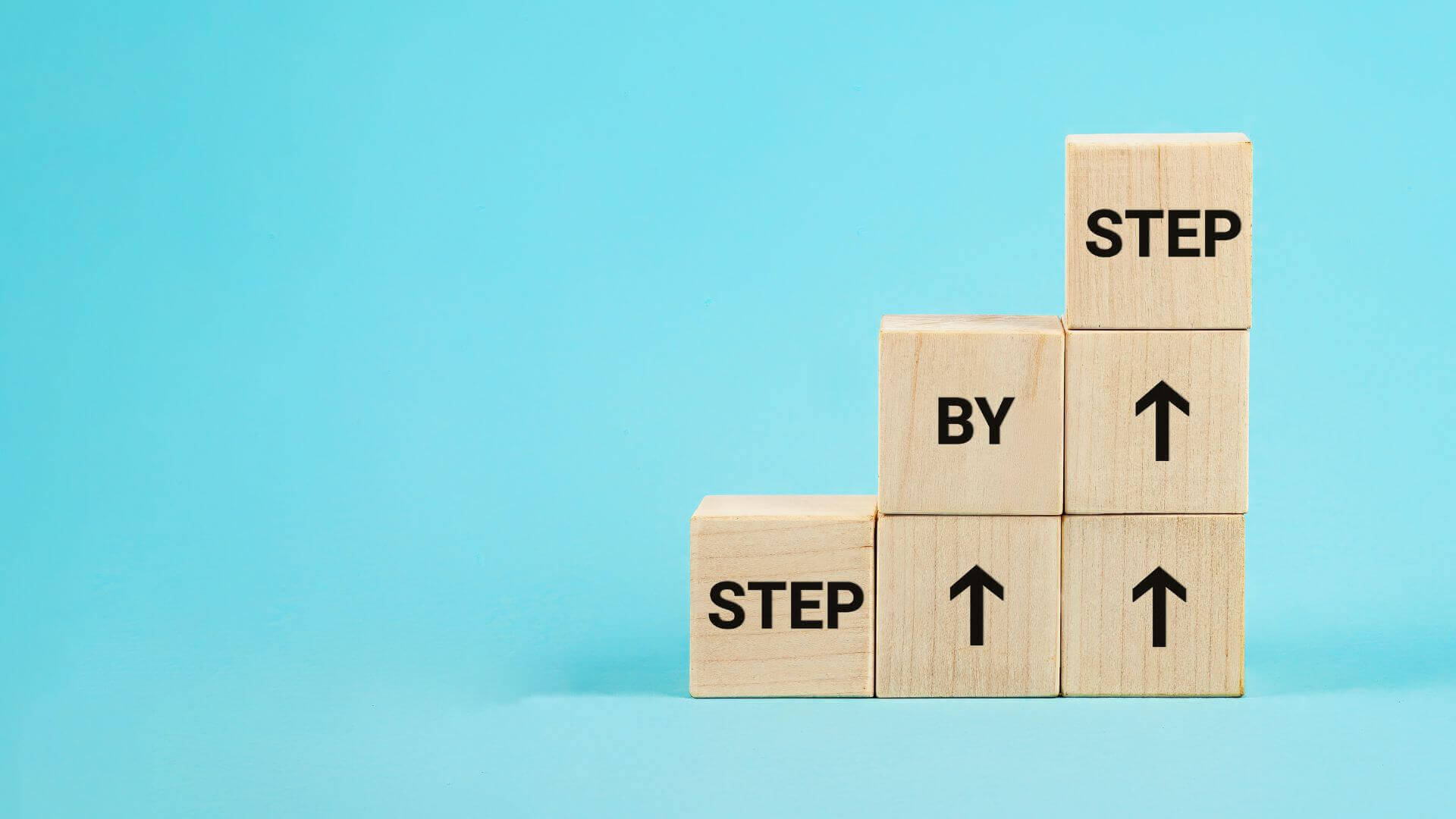 step by step written in wooden cubes