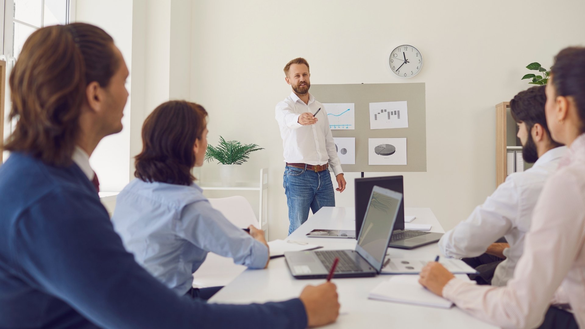 team leader presenting a report to a team