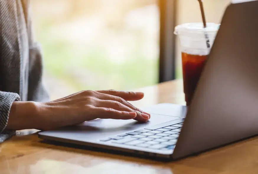 using a laptop in the coffee shop