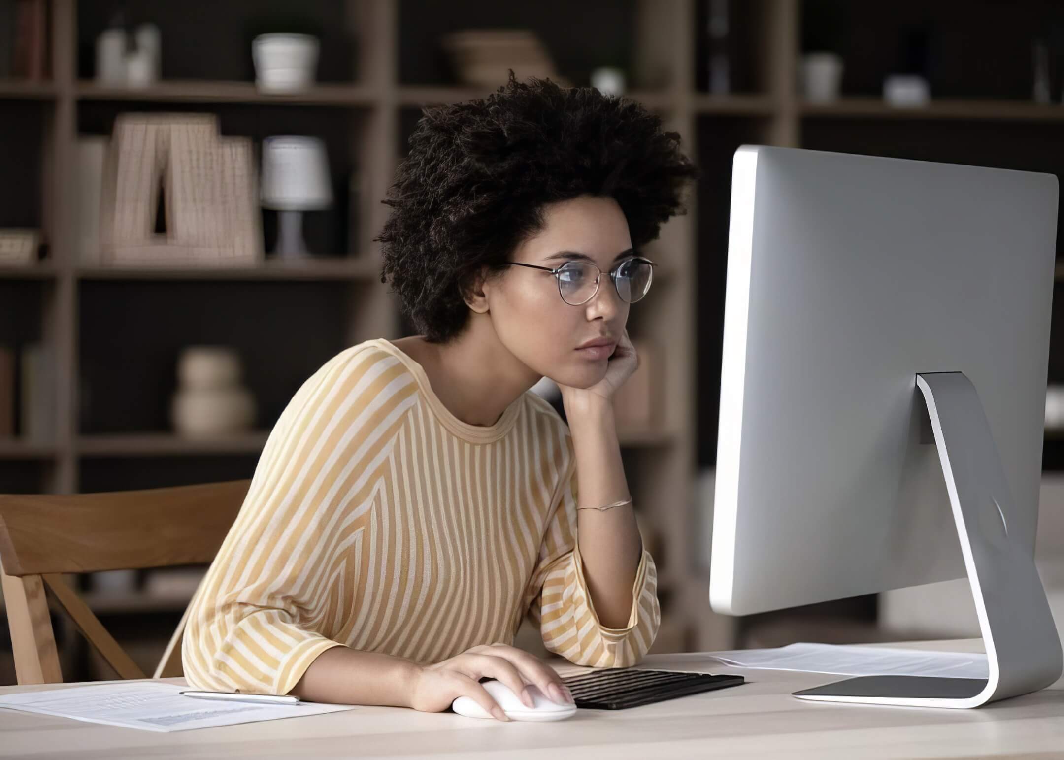 website owner checking her website downtime in her desk