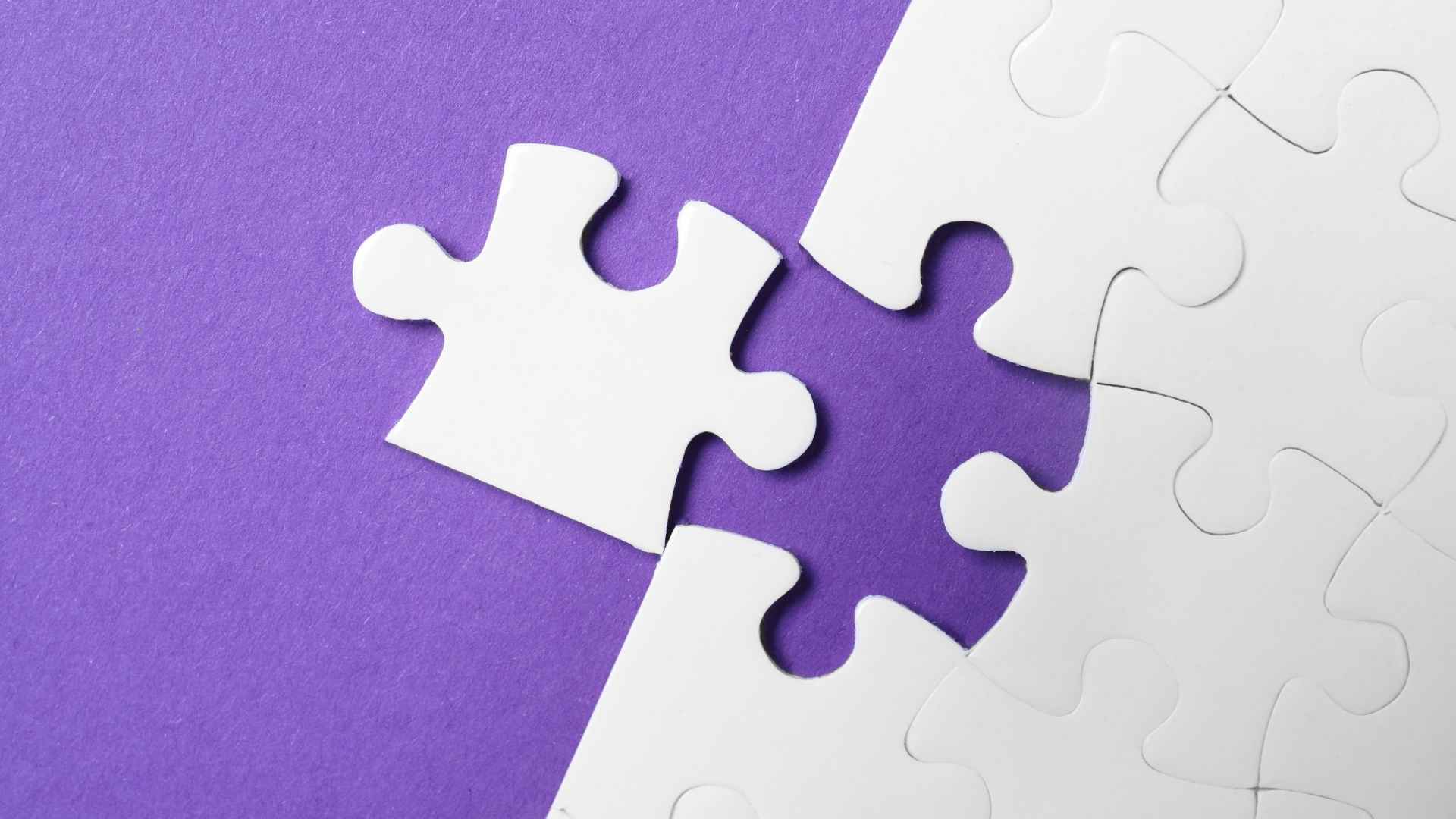 white puzzle with unfitting piece