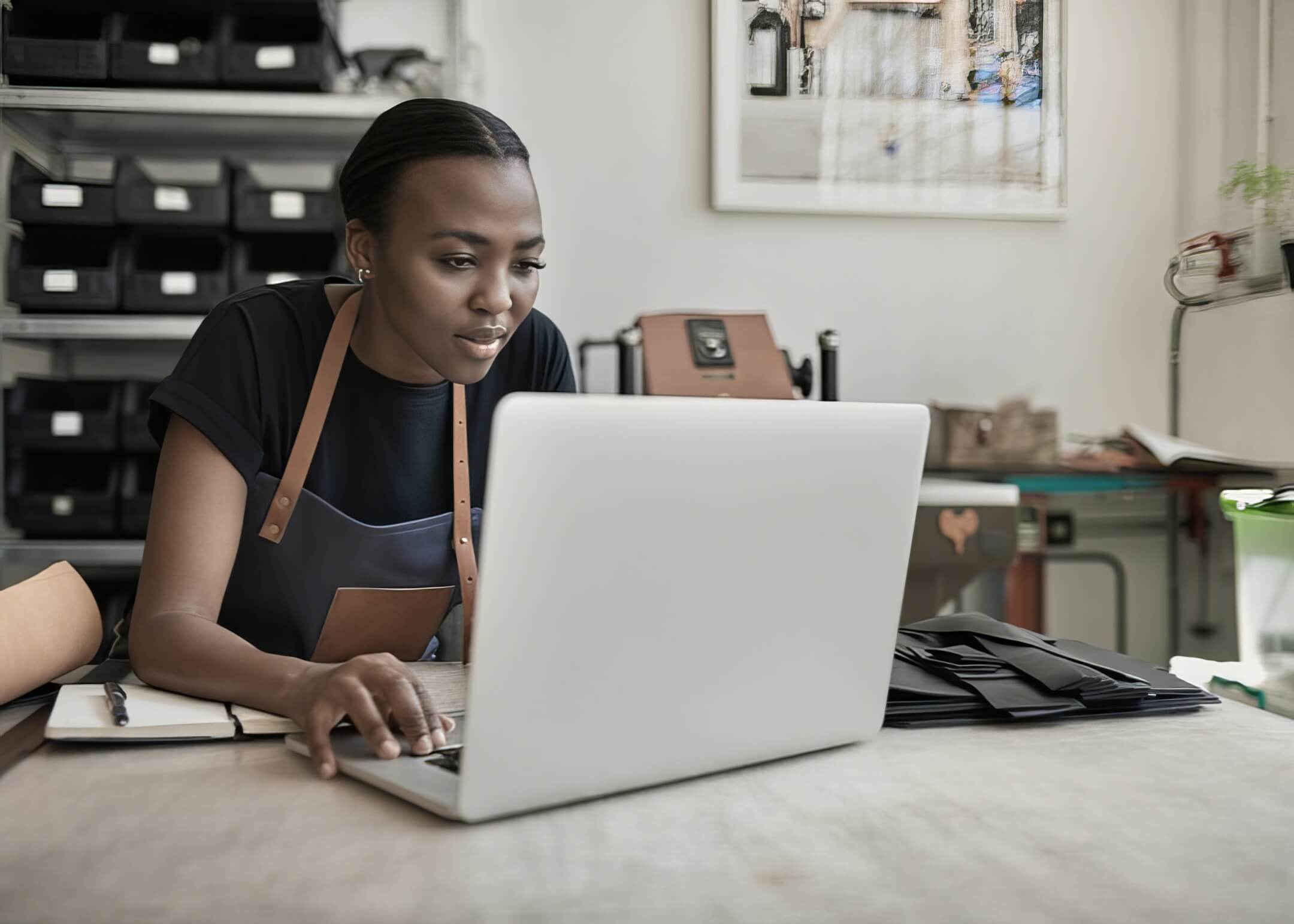 woman designing her website through her laptop