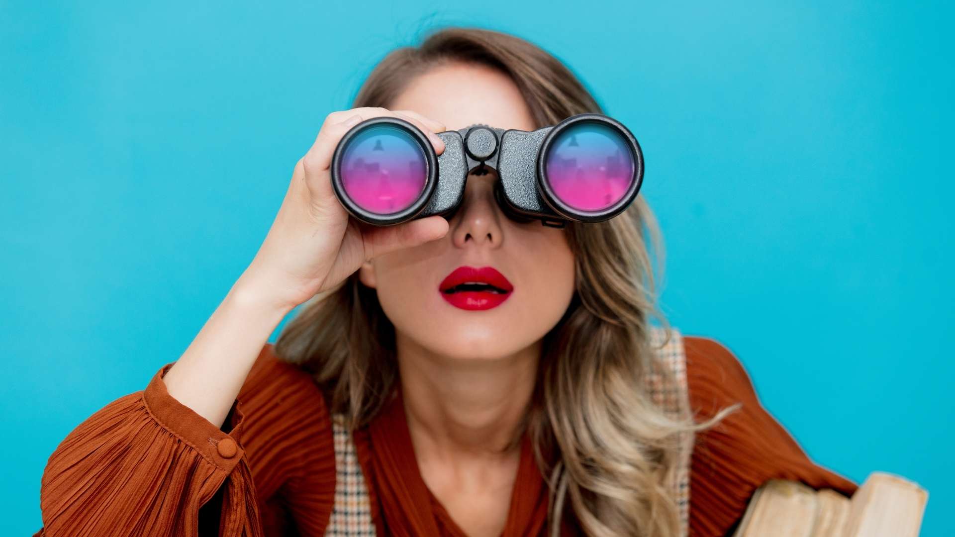 woman holding a binoculars