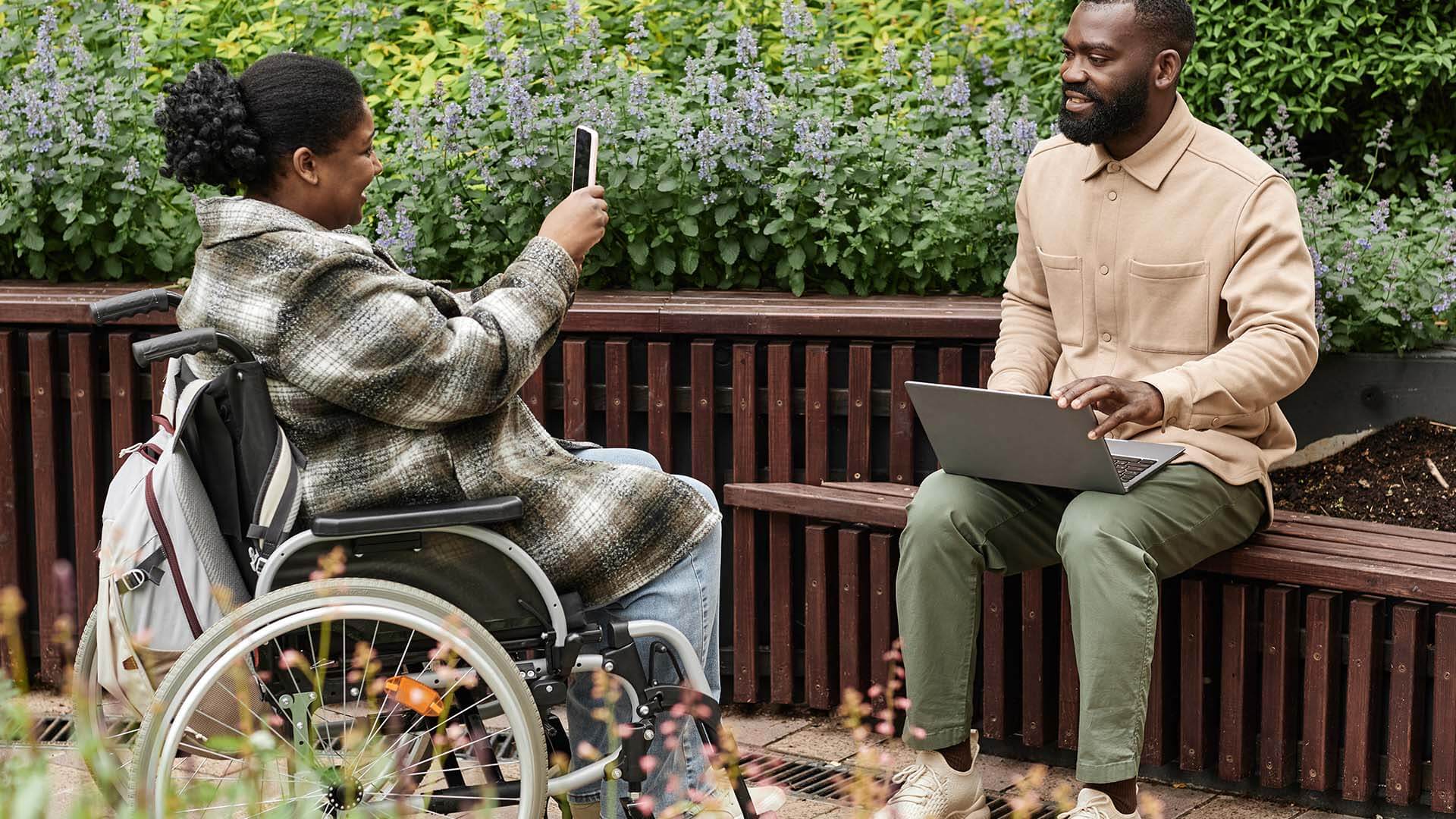 woman-with-disability-taking-smartphone-photo