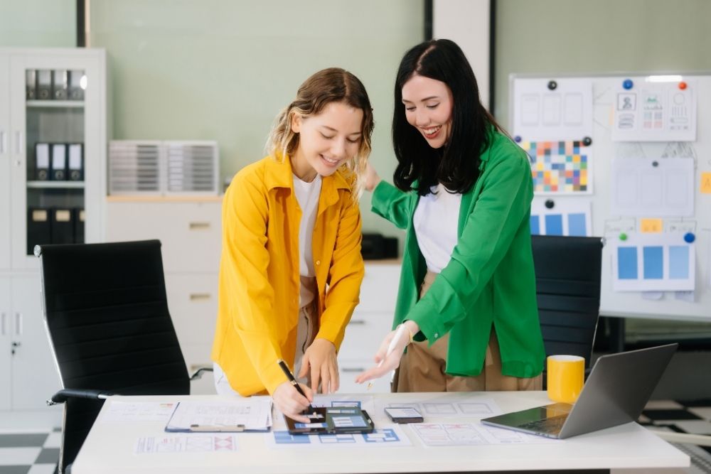 women exploring new web design templates