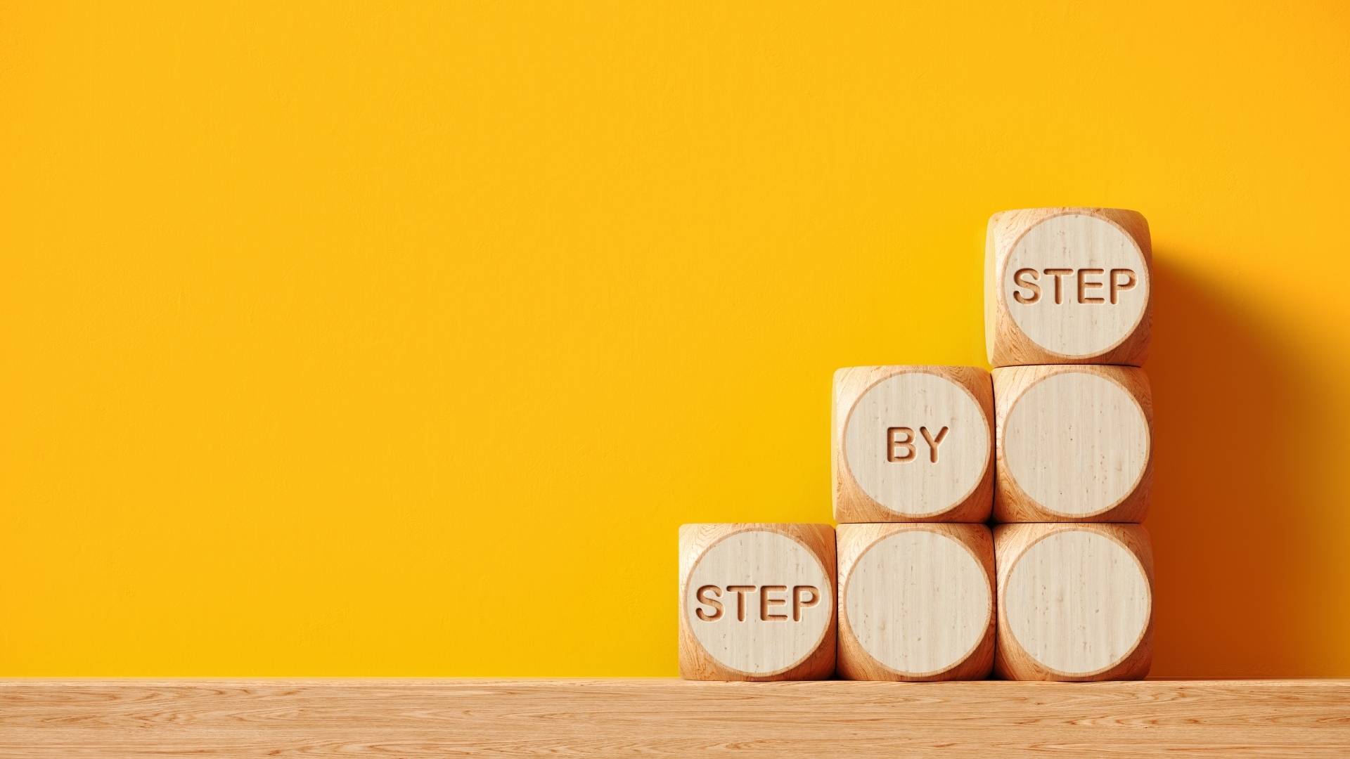 words carved on a stack of wooden cubes